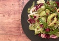 Mixed salad with avocado, pomegranate seeds and vinaigrette.