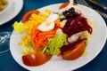 Mixed salad with eggs, fresh vegetables and boiled beet