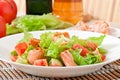 Mixed salad of fresh vegetables with pieces of salmon