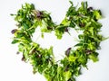 Mixed salad leaf. Lettuce spinach isolated on white background, heart shape from greenery