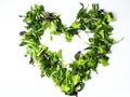 Mixed salad leaf. Lettuce spinach isolated on white background, heart shape from greenery