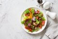 Mixed salad leaves, cherry tomatoes and red onions fresh salad