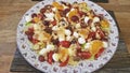 Mixed salad of tangerines, mozzarella, grapes and walnuts.