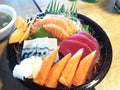 Mixed sashimi in a black cup