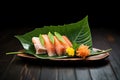mixed sashimi on a leaf, soft lighting creating a fresh vibe