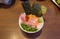 Mixed seafood donburi rice bowl with minced tuna, urchin and scallop