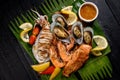 Mixed seafood grill including blue crab, mussels, large shrimp, squid and grilled salmon Royalty Free Stock Photo