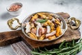 Mixed Seafood, variation of fresh mussels, clams, squid, octopus, shrimps and prawn in a skillet. White background. Top