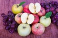 Mixed set of fresh raw ripe fruits apple grape on isolated white Royalty Free Stock Photo
