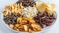 Mixed Snack Platter with Edible Insects. A diverse snack platter featuring an assortment of chips, popcorn, pasta Royalty Free Stock Photo