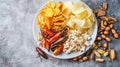 Mixed Snack Platter with Edible Insects. A diverse snack platter featuring an assortment of chips, popcorn, pasta Royalty Free Stock Photo