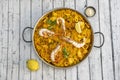 Mixed Spanish rice paella with lots of seafood, mussels, prawns, squid and chicken meat with stews