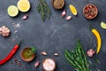 Mixed spices and herbs on black stone table top view. Ingredients for cooking. Food background. Royalty Free Stock Photo