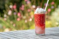 Mixed strawberry with ice and double cream on top in tall glass. Royalty Free Stock Photo