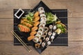 Mixed sushi roll and salmon sashimi Royalty Free Stock Photo