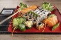 Mixed sushi roll and salmon sashimi Royalty Free Stock Photo