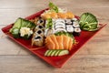 Mixed sushi roll and salmon sashimi Royalty Free Stock Photo