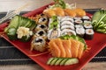 Mixed sushi roll and salmon sashimi Royalty Free Stock Photo