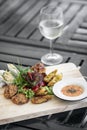 Mixed asian seafood snacks platter on restaurant table