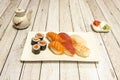 Mixed tray of assorted sushi, nigiri and maki with Norwegian salmon, cooked prawns, butterfish and red tuna