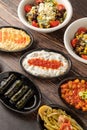 Mixed Turkish appetizers on wooden table. Turkish Mezze. such as stuffed leaves, humus