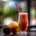 Mixed various summer fruit smoothie on a table against a summer outdoor background.