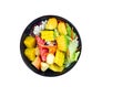 Mixed vegetable and fruit salad in black bowl Royalty Free Stock Photo