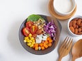 Mixed vegetable salad on borwn bowl and almond over white wooden. Royalty Free Stock Photo