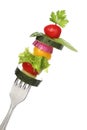 Mixed vegetables on a fork isolated Royalty Free Stock Photo