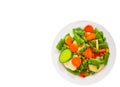 Mixed vegetables on a plate. top view. isolated