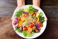 Mixed vegetables salad holding by hand Royalty Free Stock Photo