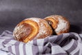 Mixed wheat german bread Fresh loaf on a dark background. Traditional wheat freshly rustic baked bread, loaf of bread