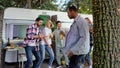 Mixedrace party of friends with beer in their hands. Have fun listening to music and dancing at festive summer parties