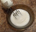 Mixer in bowl with bizet for cake on table