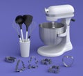 Mixer and metal cookie cutters with kitchen utensil for making cookies on violet Royalty Free Stock Photo