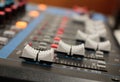 Mixer in recording room. Closeup button to increase or decrease Royalty Free Stock Photo