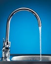 Mixer tap with flowing water Royalty Free Stock Photo