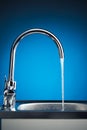 Mixer tap with flowing water Royalty Free Stock Photo