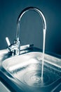 Mixer tap with flowing water Royalty Free Stock Photo