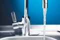 Mixer tap with flowing water Royalty Free Stock Photo