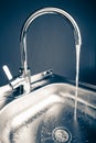 Mixer tap with flowing water Royalty Free Stock Photo