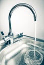 Mixer tap with flowing water Royalty Free Stock Photo