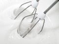 Mixer whisks whip pastry cream. Royalty Free Stock Photo