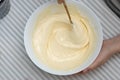 Mixing Baking Dough for Waffles, Egg Yolks and Milk, in a Glass Bowl. Food Preparing Process Photography Concept Royalty Free Stock Photo