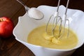 Mixing Batter or dough for apple-pear cake or muffin or pancake. Close up in wooden table c ingredients