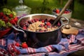 mixing bowl with berry cobbler filling outdoors Royalty Free Stock Photo