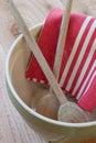 Mixing bowl with spoons and towel