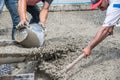 Mixing cement concrete at construction site Royalty Free Stock Photo