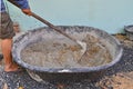 Mixing cement poder and sand by using hoe in mortar pan Royalty Free Stock Photo