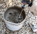 Mixing concrete mortar at a house construction site